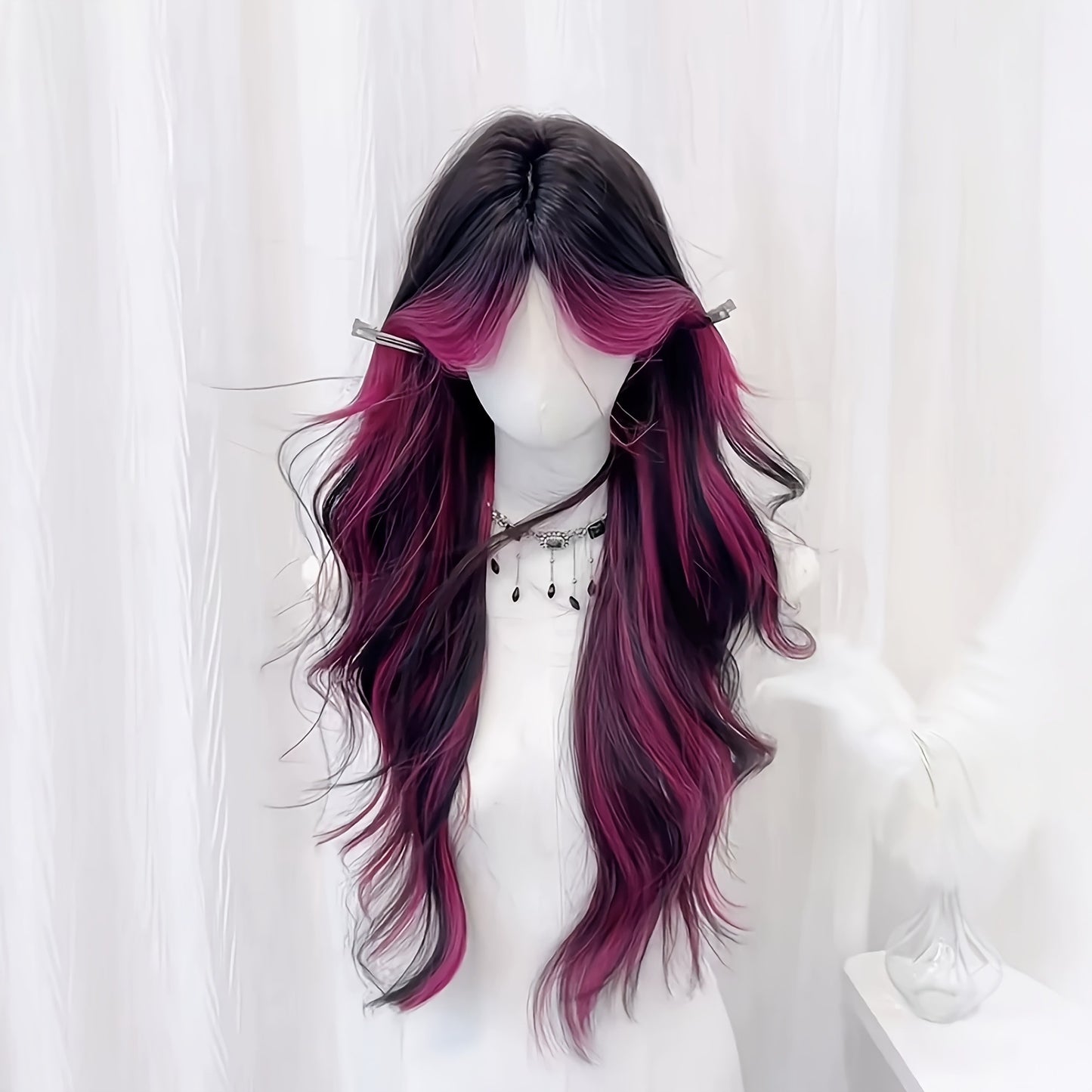 Long curly wig with bangs and highlights parted in the middle